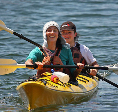 Kids in a yellow double kayak