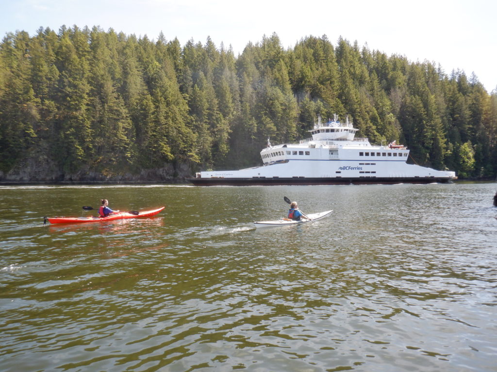 kayaking with ferry nearby